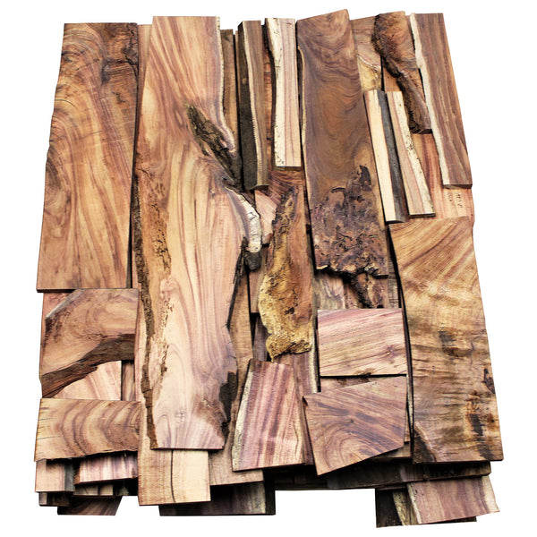 Collection of koa boards, showing varying colors, sizes, and figure grades.