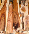 Collection of koa boards, showing varying colors, sizes, and figure grades.