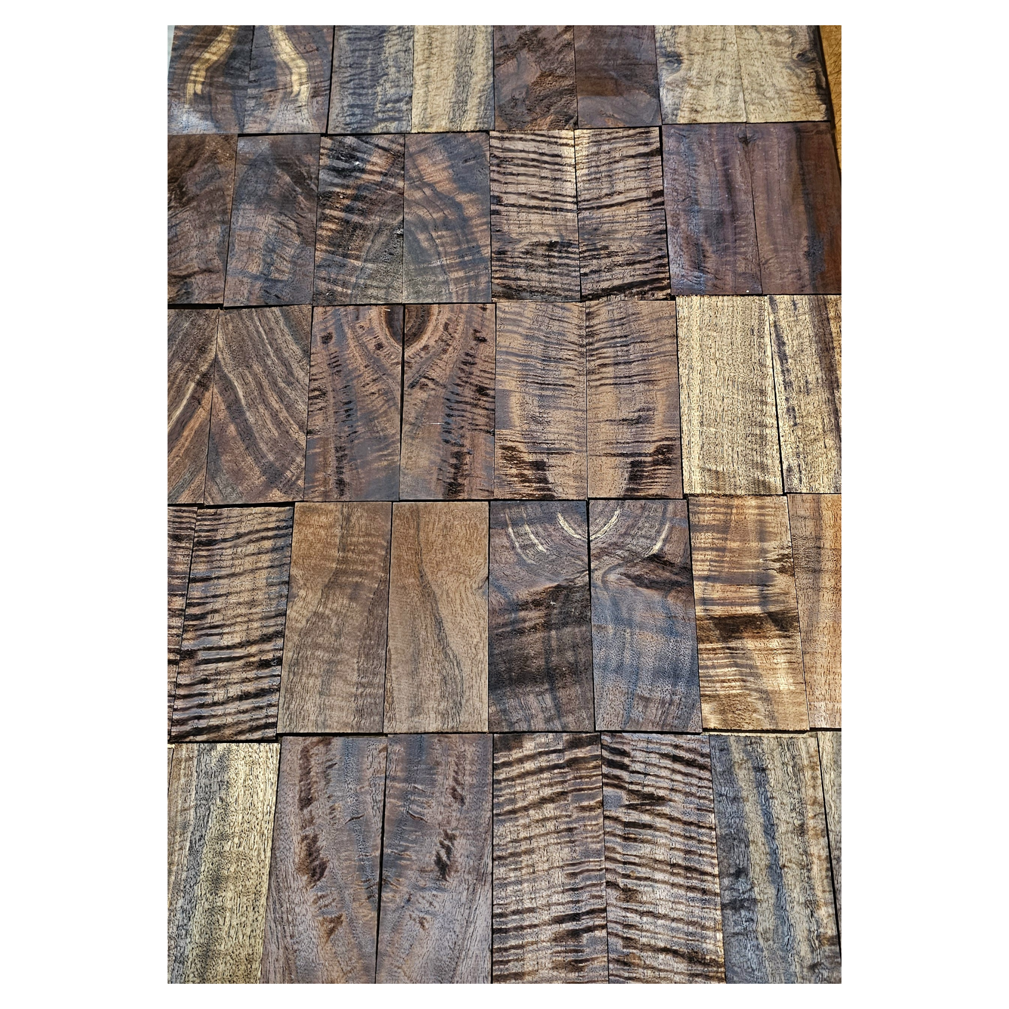 Bookmatched knife scales showing a range of color, figure and grain.