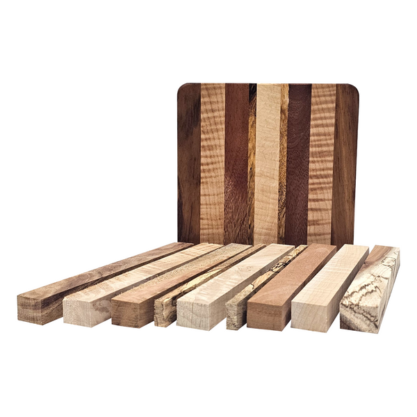 Set of wooden cutting boards with various grain patterns on a white background