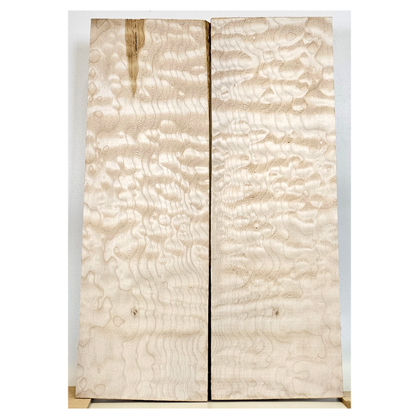 Quilted maple 2-piece set with 4A grade quilting throughout, tiny burls scattered and a light green streak.