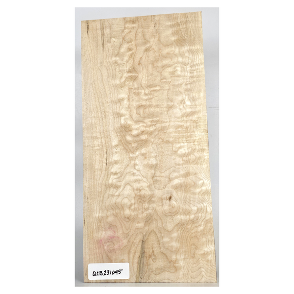 Lightly quilted maple craft board with soft color streaks and scattered bird pecks.
