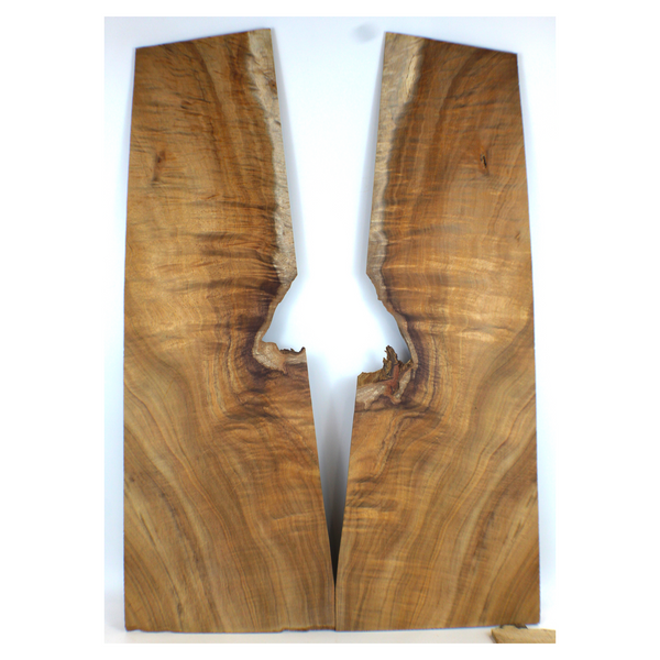 Curly koa book matched set with 5A grade curl that rolls from well quartered to off quarter.  Pieces are clean of defect, but narrow where the cool edge void is.  Sanded to 400 grit.  Dimensions: Thickness (each piece): .25", Max width: 9.75", Length: 28".