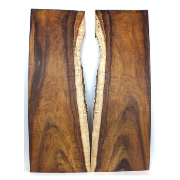 Long curly koa book matched set with pretty color, interesting grain lines and sap line. Curl is strong on the edges, where it is quartered, and softens to light flat sawn velvet in the center.  This set has been sanded to 400 grit.  Dimensions: Thickness (each piece): .25", Width: 9.25", Length: 26.75"