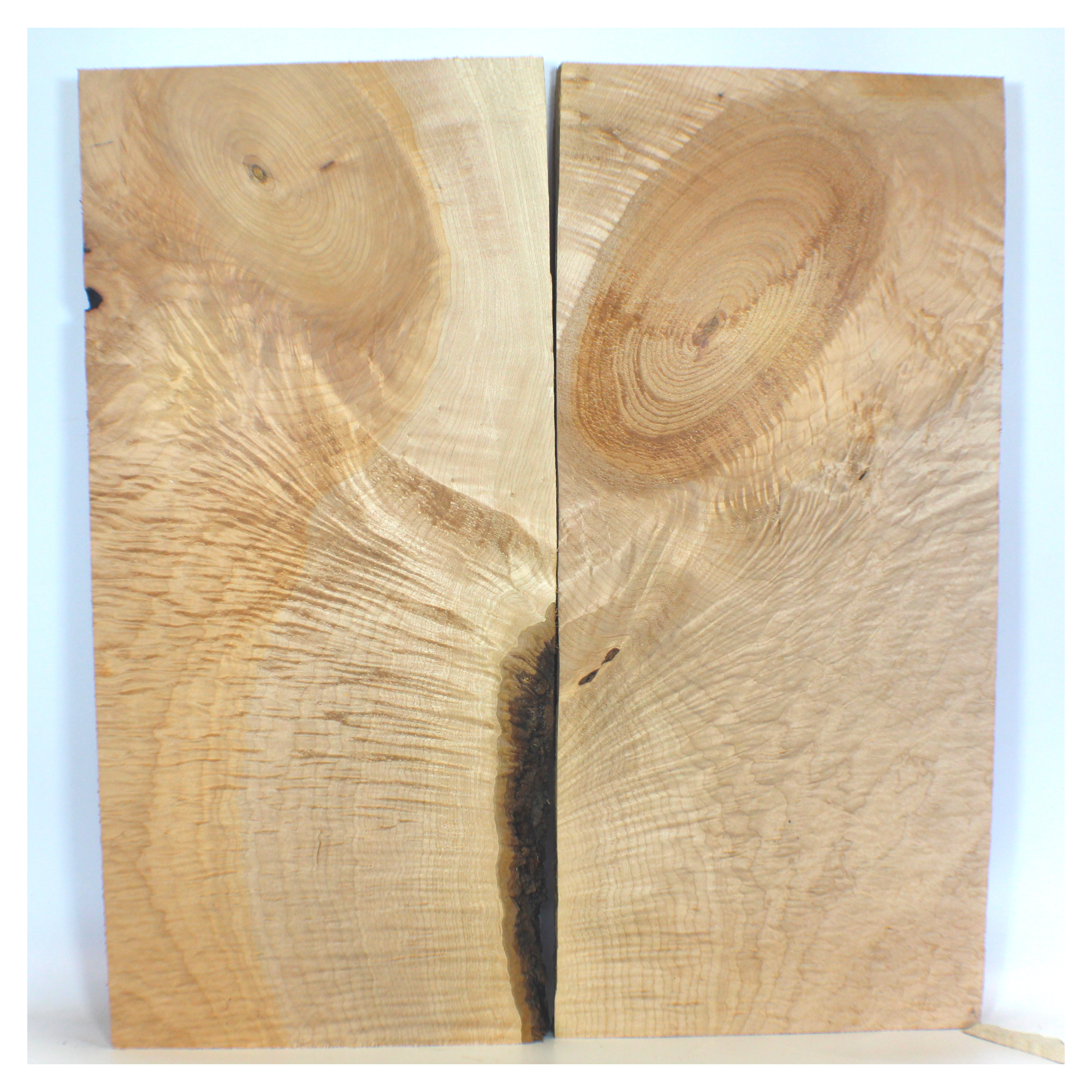 Unique flat sawn flame maple book-matched set with large knot, two-toned color, and swirly angel set figure.  Dimensions: Thickness each piece: 1.25