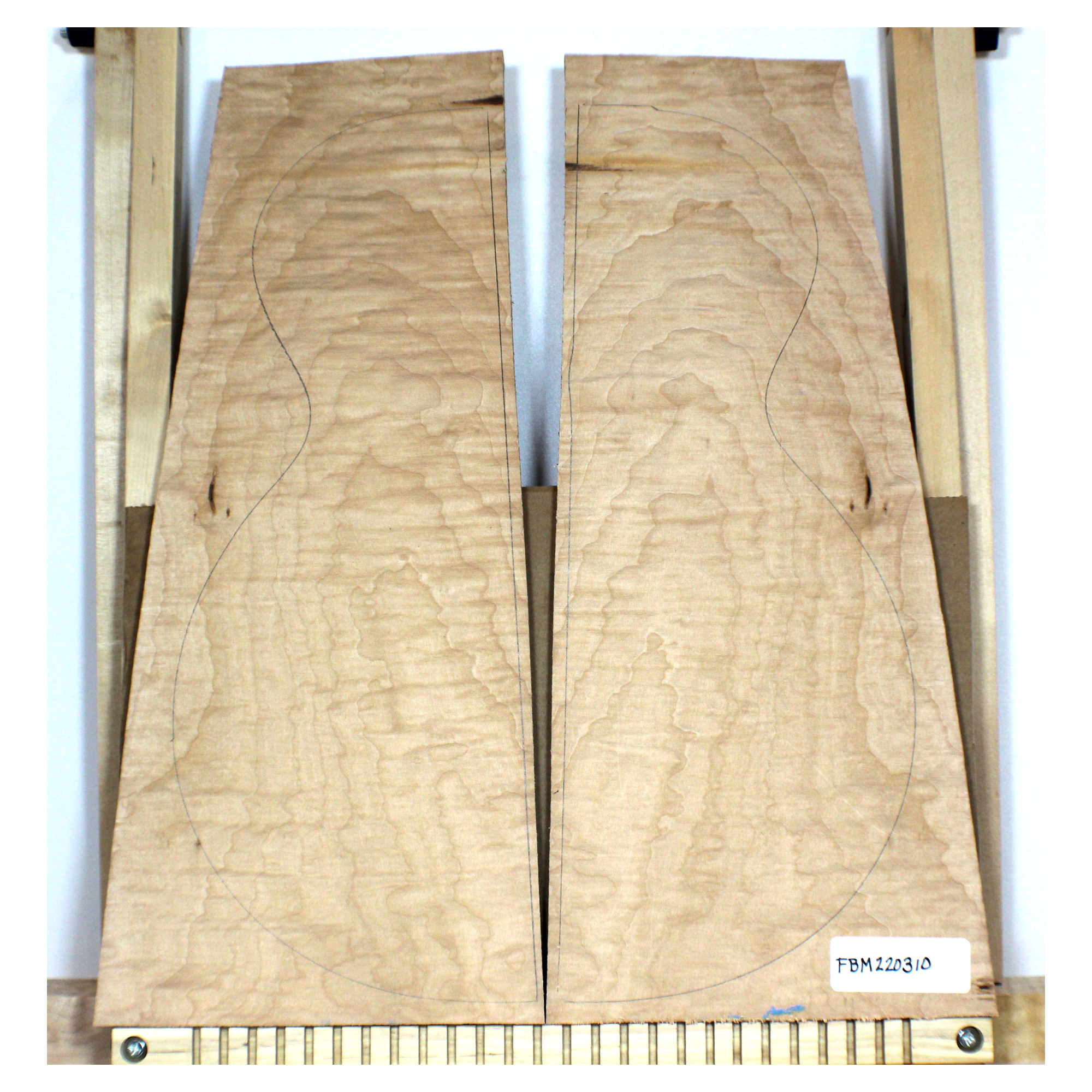 Nicely figured, 4A grade flat-sawn flame maple book-matched set with bird pecks.  These may pattern for guitars.  There is two-tone color on the glue down side of one piece.  Dimensions: Thickness (each piece): .75