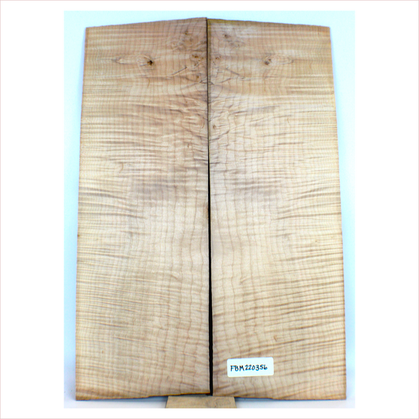 Nice, well-quartered 2-piece flame maple book-matched set with 4A figure, uniform color, cambium inclusions (small) and a small pin knot.  This set has a slight undercut on the edge of one piece.  It has been sanded to 400 grit.  Dimensions: Thickness (each piece): .25", Width: 7.55", Length: 22".