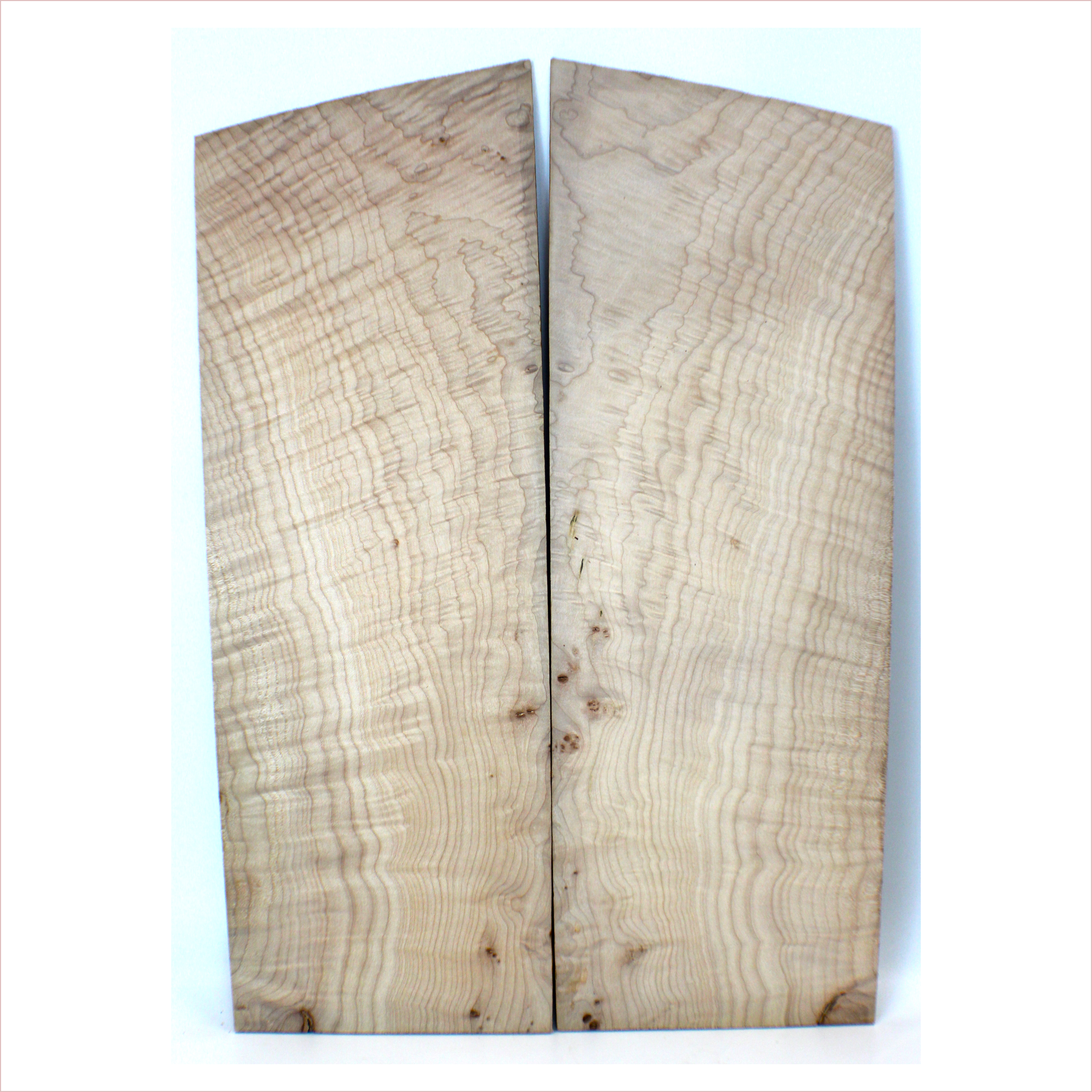 4A grade flame maple book-matched set with slightly off-quartered figure, giving it wavy figure lines and light angel step patterning.  There are tiny burls in this set.  It has been sanded to 400 grit.  Dimensions: Thickness (each piece): .25