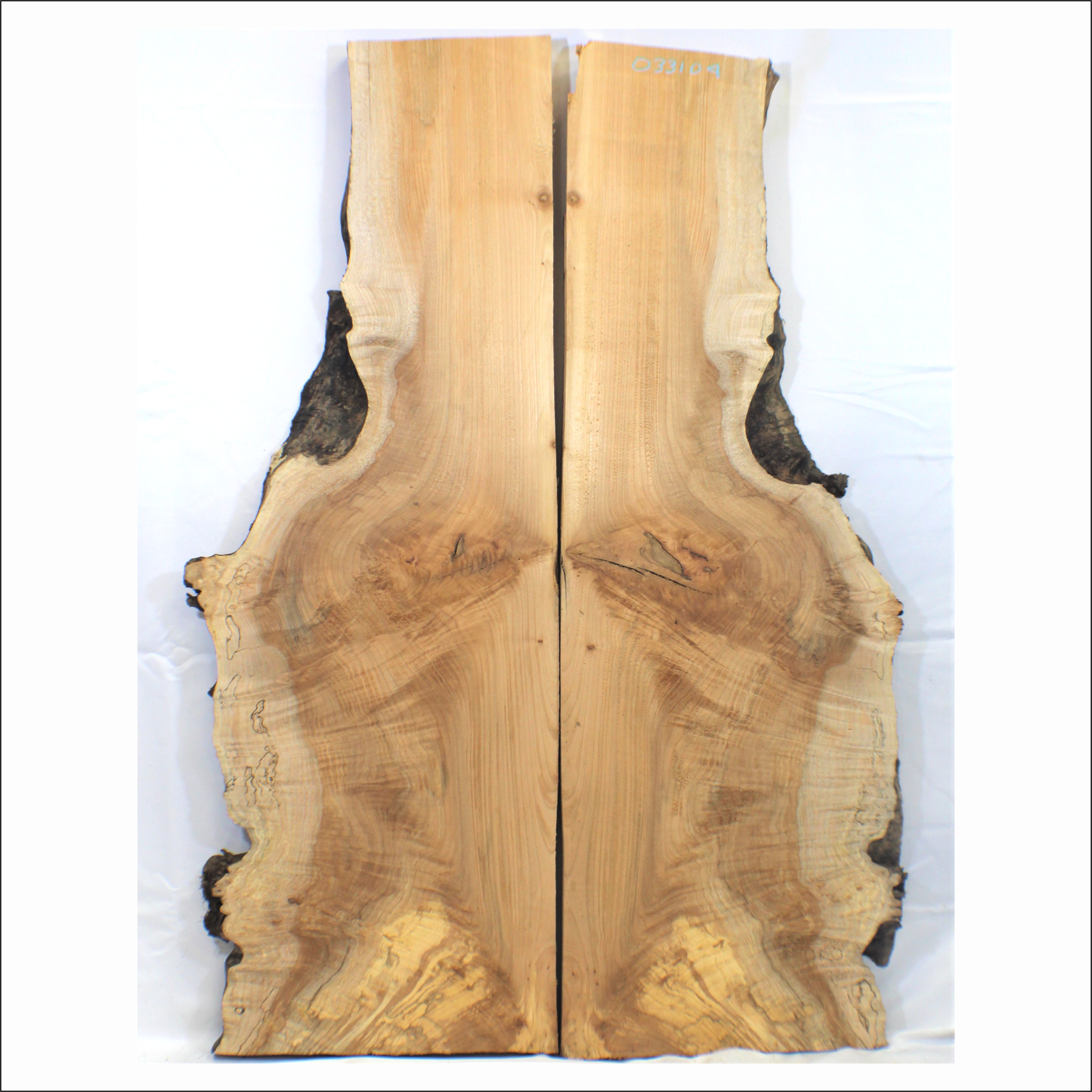 2-piece flame table set with light to medium curl throughout, burls, and live edge.  Dimensions: Thickness each piece: 1.25