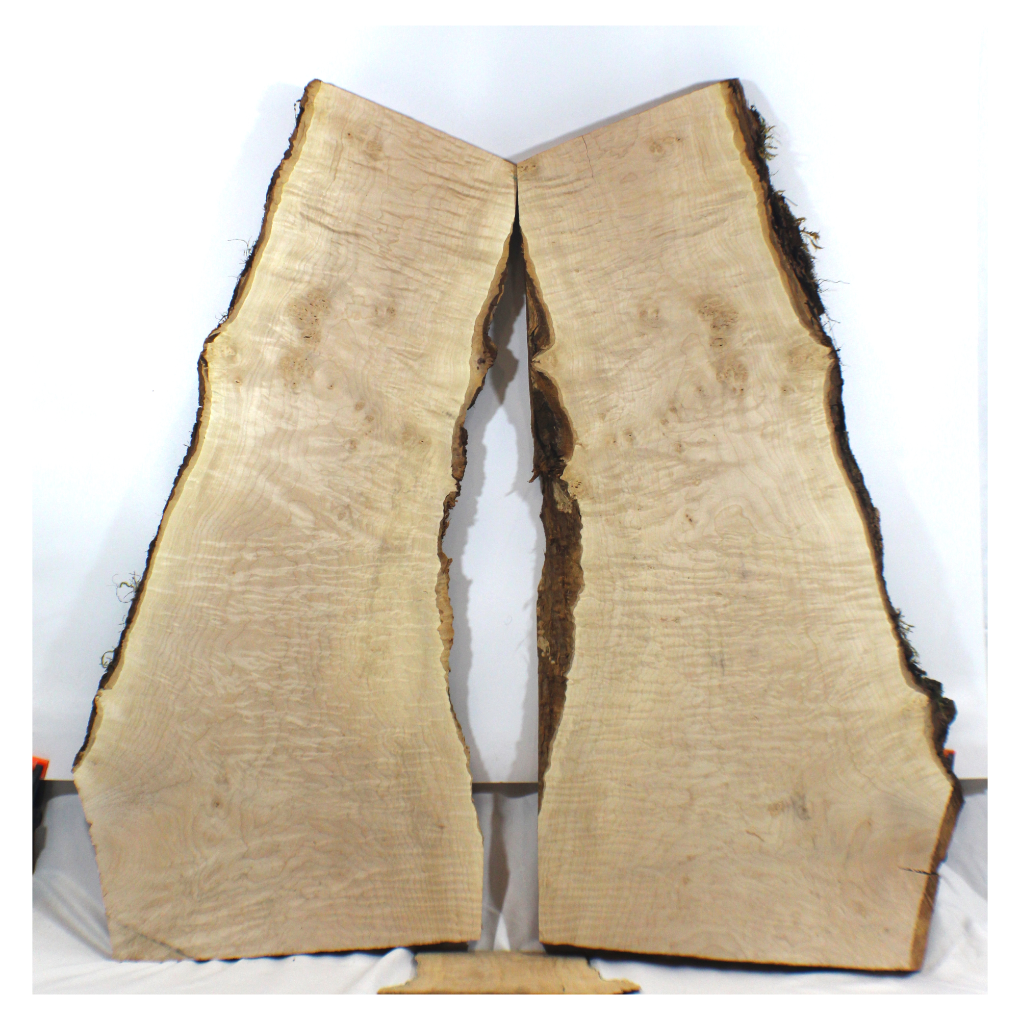 two-piece flame maple set with high curl, burls, and two live edges. Dimensions: thickness each piece: 1.25