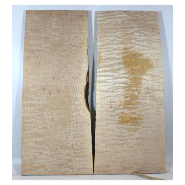 Beautiful quilted maple book-matched set with 4A grade figure, no color or stain, and tiny burls in the center.  Dimensions: Thickness (each piece): .75, Width: 10", Length: 23".
