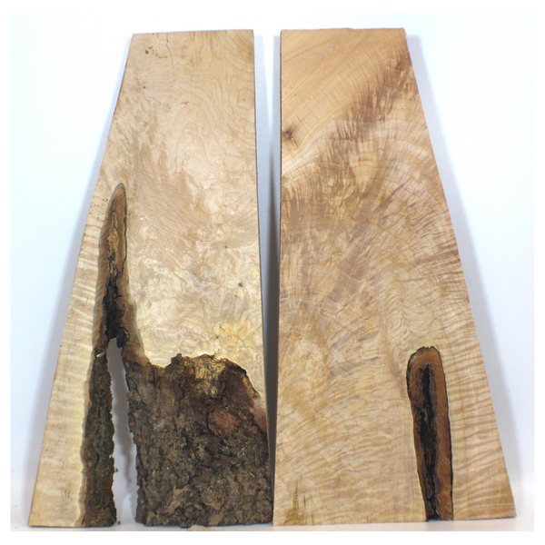 Interesting quilted maple book-matched set with high grade quilting, void, feather, and cool shape.  Dimensions: Thickness each piece: 1.25", Max width: 10", Length: 20.5".