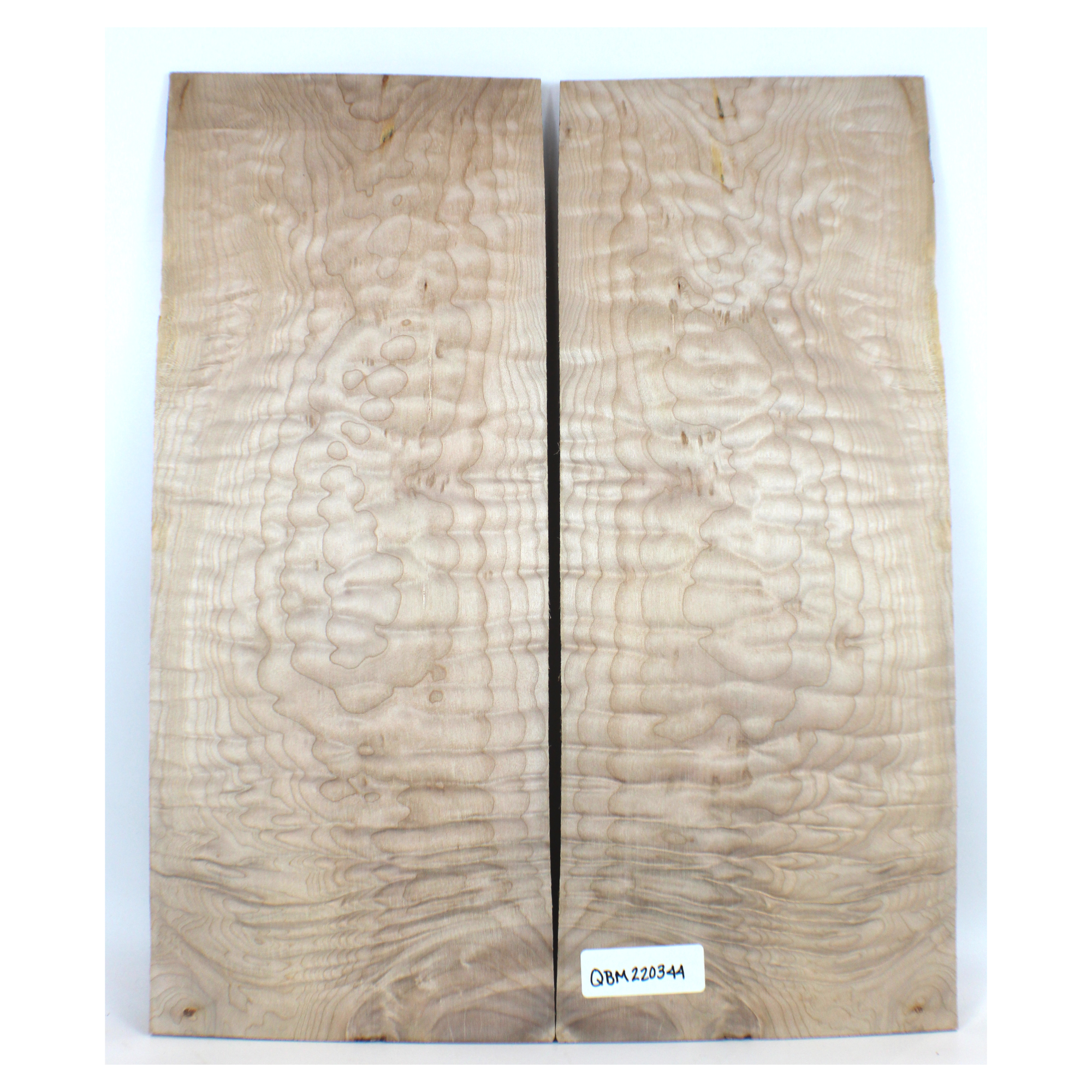 2-piece quilted maple book-matched set with 4A figure and really interesting grain patterning.  There are cambium inclusions and some face checking in this set.  It has been sanded to 400 grit.  Dimensions: Thickness (each piece): .25