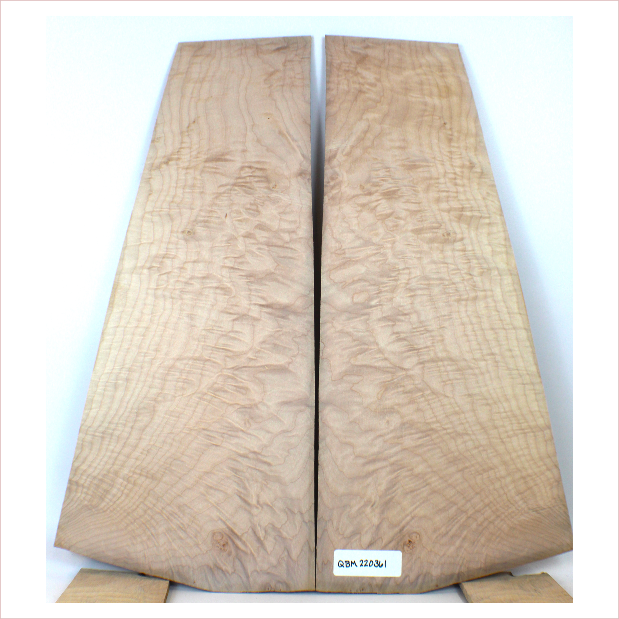 Interesting quilted maple book match with flat-sawn flame figure on the edges.  3A grade figuring and little burls.  This set has been sanded to 400 grit.  Dimensions: Thickness (each piece): .25