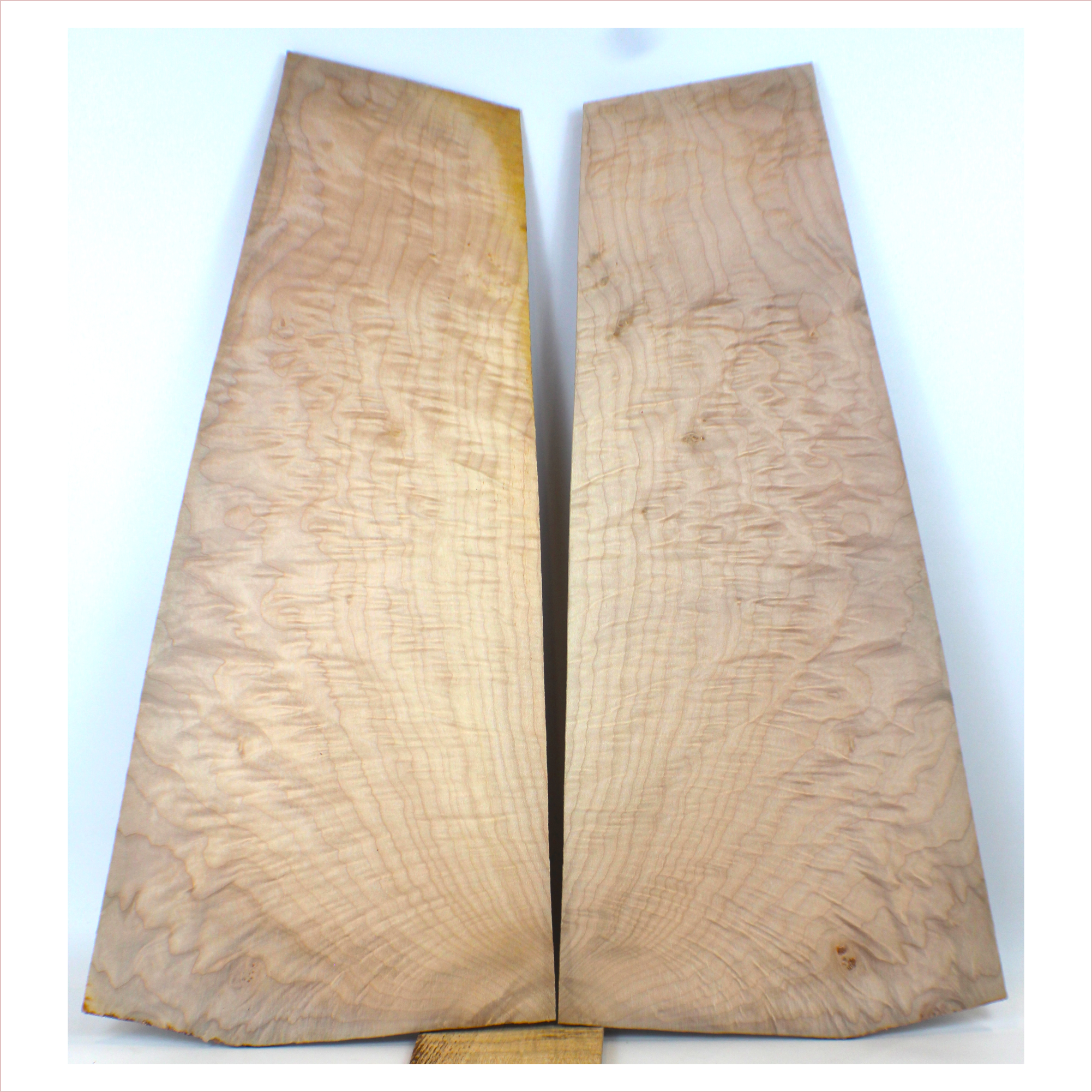 Interesting quilted maple book match with flat-sawn flame figure on the edges.  3A grade figuring and little burls.  This set has been sanded to 400 grit.  Dimensions: Thickness (each piece): .25