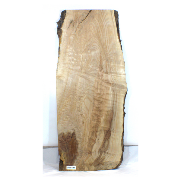 Quilted maple table slab with nice figure, beautiful color streak, and live edge. Dimensions: Thickness: 1.25", Max width: 19.25", Length: 44.75.